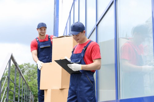 Professional movers handling fragile belongings in a Belgravia property