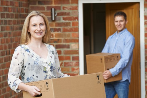 Expert movers relocating a piano from a luxury Belgravia property
