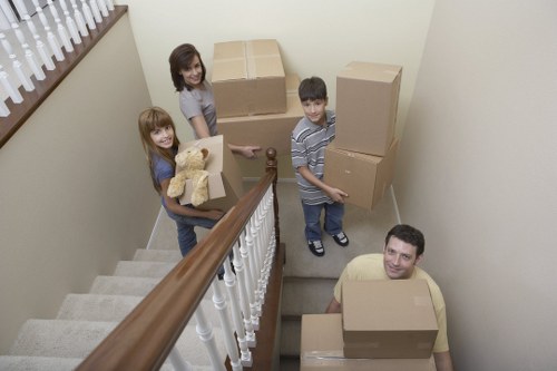 Moving professionals loading boxes into a removal van